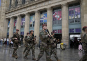 soldiers patrol outside gare du nord train station Paris