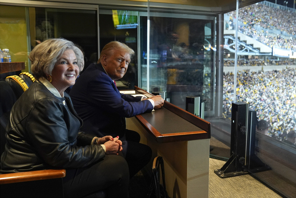 Donald Trump sits with Susie Wiles