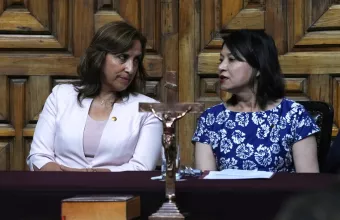 Peru's President Dina Boluarte, left, talks to Foreign Minister Ana Cecilia Gervasi 