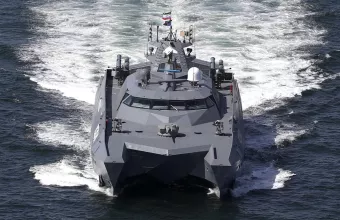A catamaran moves in the Iranian waters prior to the start of a joint naval drill of Iran, Russia and China in the Indian Ocean