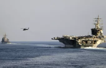 The aircraft carrier USS Dwight D. Eisenhower and other warships crosses the Strait of Hormuz