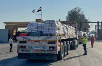 Trucks carrying humanitarian aids enter the Rafah