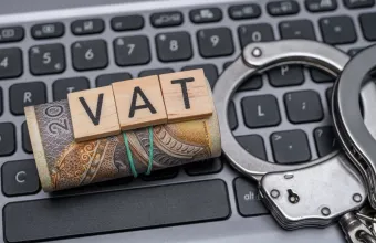 VAT fraud, Polish money, handcuffs and computer close up