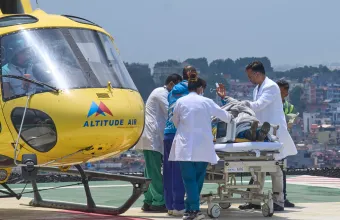 Medics take Dawa Sherpa, a mountain guide who had been missing for several days in the Everest