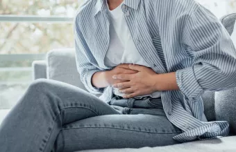 pain holding belly stomach