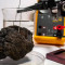 A nodule from the seabed being tested in a lab  