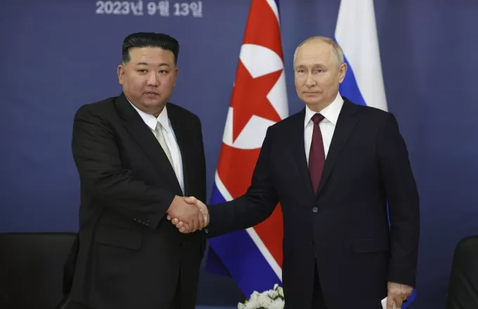 Russian President Vladimir Putin, right, and North Korea's leader Kim Jong Un