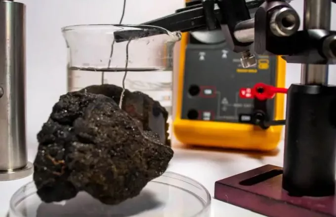 A nodule from the seabed being tested in a lab  