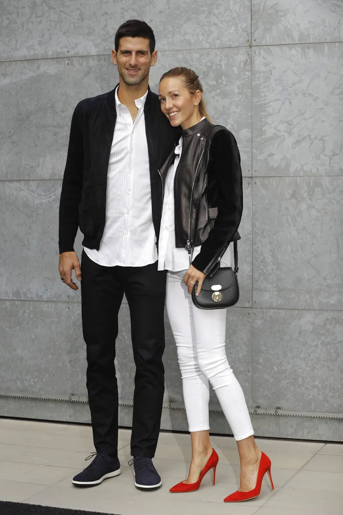  Novak Djokovic, left, flanked by his wife Jelena