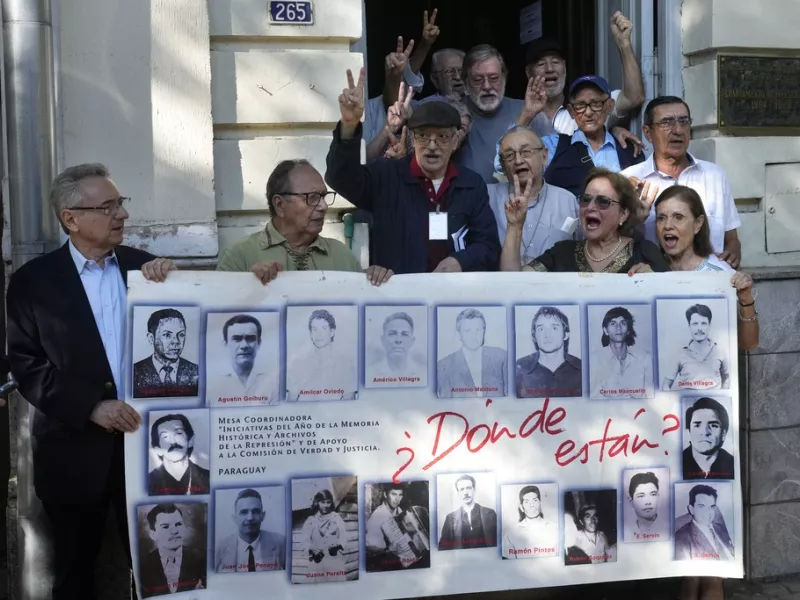 Paraguay - Torture Trial - Former political detainees shout slogans against the dictator Alfredo Stroessner dictatorship 