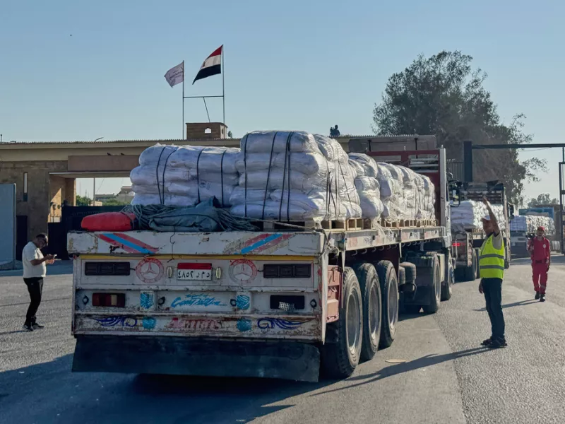 Trucks carrying humanitarian aids enter the Rafah