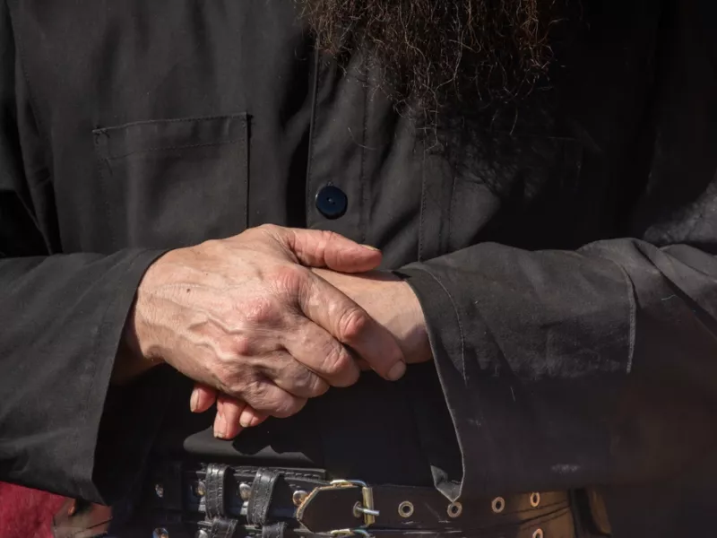 The hands of an old monk 