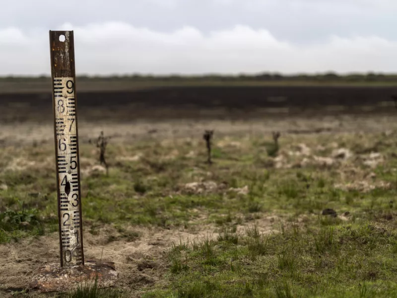 A water meter stands in a dry wetland in Donana natural park, southwest Spain