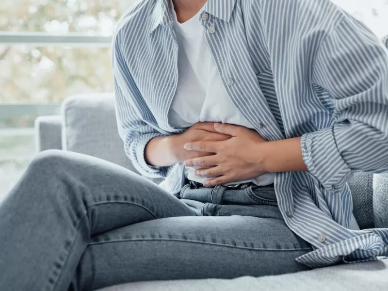 pain holding belly stomach